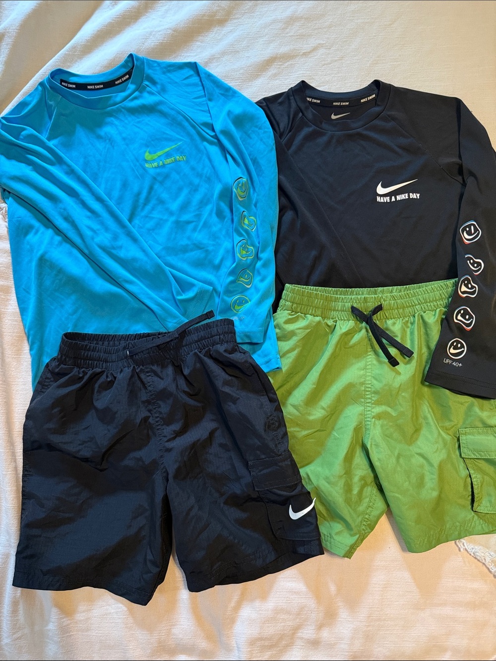 Two sets, Nike rash guard/swim shorts, size small (boys 8-10)
